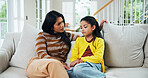 Advice, conversation or guidance with mother and daughter on sofa in living room of home together. Relationship, relax or support with girl and woman parent in apartment for bonding or direction