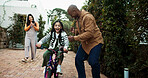 Parents, bicycle and girl with learning, celebration or recording video with phone, memory and bonding. People, mother and father with child, smartphone or photography for teaching with goals on bike