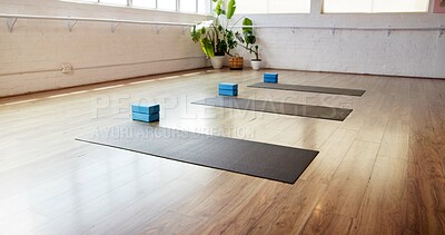 Buy stock photo Yoga, block and equipment with mat in studio for fitness, empty room and wellness class. Pilates session, exercise space and interior of health club for training setup, holistic gear and gym center