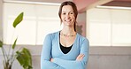 Arms crossed, portrait and yoga with woman in studio for fitness, holistic health or wellness. Balance, confidence and smile with happy yogi person in class for commitment or dedication to exercise