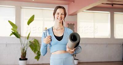 Buy stock photo Bottle, portrait and yoga mat with woman in studio for fitness, holistic health or wellness. Hydration, water and smile with happy yogi person in class for commitment or dedication to exercise