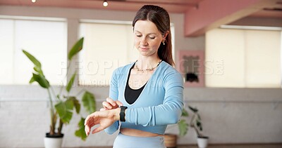 Buy stock photo Woman, scroll and smart watch in gym studio for exercise, tracking heart rate and fitness app. Person, reading and check time with workout results, wellness or monitor step counter for goal progress.