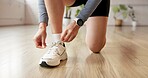 Person, hands and tying laces with shoes for workout preparation, start exercise or indoor training. Closeup, active or tie with sneakers or getting ready for fitness, run or gym in health club