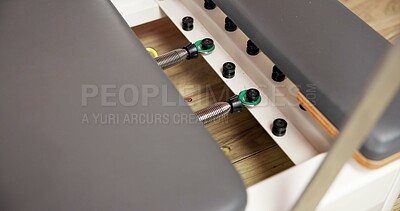 Buy stock photo Reformer, gym or equipment with sliding carriage for pilates, health or indoor exercise. Empty space, interior or workout machine with adjustable spring for fitness, flexbility or resistance training