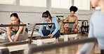 Reformer, fitness and women in studio, exercise and pilates class with resistance. Healthy people, training machine and group in wellness center, equipment and endurance with workout and stretching