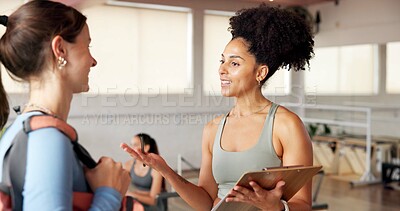 Buy stock photo Fitness, clipboard and women in studio, conversation and sign up with training schedule. People, gym owner and coach with documents, exercise and pilates with recruitment, membership and planning