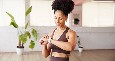 Buy stock photo Studio, woman and check smart watch for fitness, performance tracking or health information. African person, exercise and wristwatch for timer, workout progress and happy with heartbeat monitor