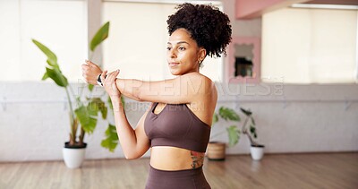 Buy stock photo Fitness, woman and stretching arms in studio for wellness, health and start yoga. African person, yogi and warm up at club for pilates preparation, flexibility and getting ready to exercise muscle