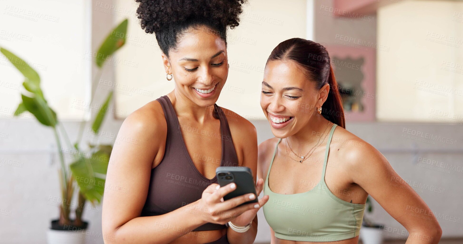 Buy stock photo Fitness, women and friends with phone in yoga studio for funny post, show meme and laughing. Pilates break, people and smile with smartphone at health club for comic video, humor and exercise gossip