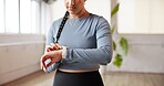 Hands, woman and smart watch in studio for fitness, performance tracking or health information. Exercise, person and check wristwatch for timer, workout progress or heartbeat monitor for wellness