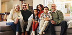 Grandparents, parents and children on sofa for portrait in home for love, relationship and bonding. Family, generations and kids with mom, dad and senior people for trust, support and relax together