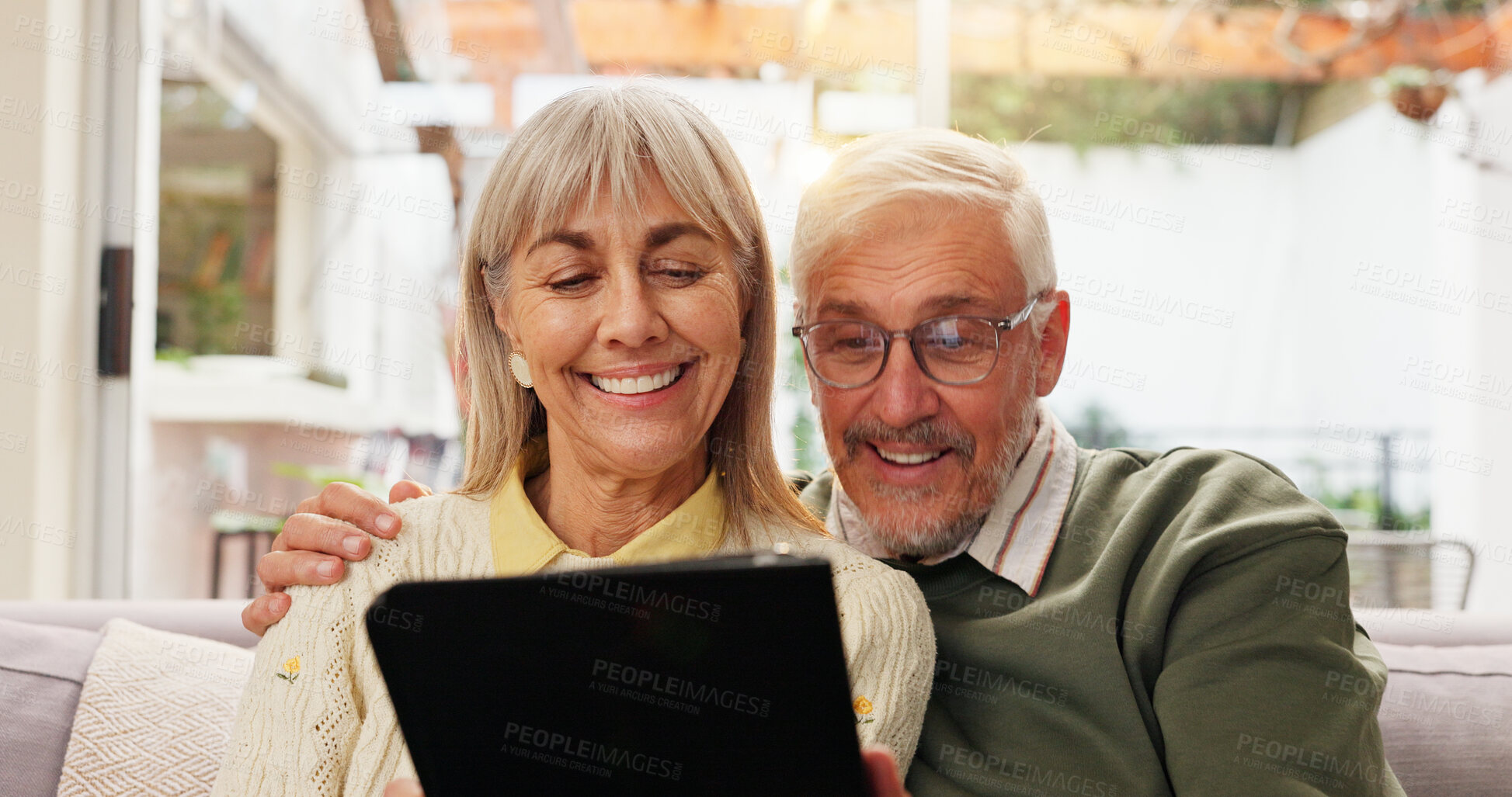 Buy stock photo Tablet, happy and senior couple on sofa in home watching film, series or show together. Relax, digital technology and elderly man with woman for streaming movie on app in living room at house.