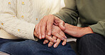 Holding hands, together and senior couple in home for commitment, support and relationship. Retirement, marriage and closeup of elderly man with woman for love, bonding and trust in living room