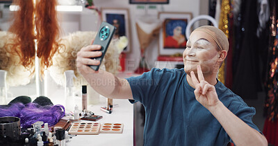 Buy stock photo Person, selfie and drag artist in dressing room with application for performance, cabaret or show. Talent, beauty and lgbt performer at club with cosmetics, ready or peace sign for concert at theater