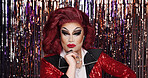 Drag performer, makeup or streamer decoration for transformation, beauty or creative expression. Portrait, LGBTQ person or artist with gender exploration, performance or alter ego on curtain backdrop