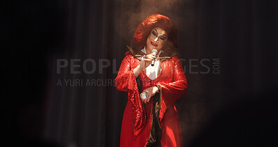 Buy stock photo Person, drag queen and talk with mic on stage performance, hosting show and storytelling. Artist, spotlight and acting for live entertainment, theater event and unique character for nightlife talent