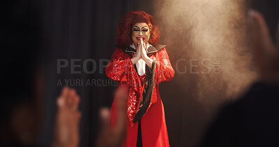 Buy stock photo Person, drag artist and smile with thanks, stage and excited with respect for crowd at cabaret show. Lgbt performer, musician or singer with gratitude, happy and pride with prayer hands for audience