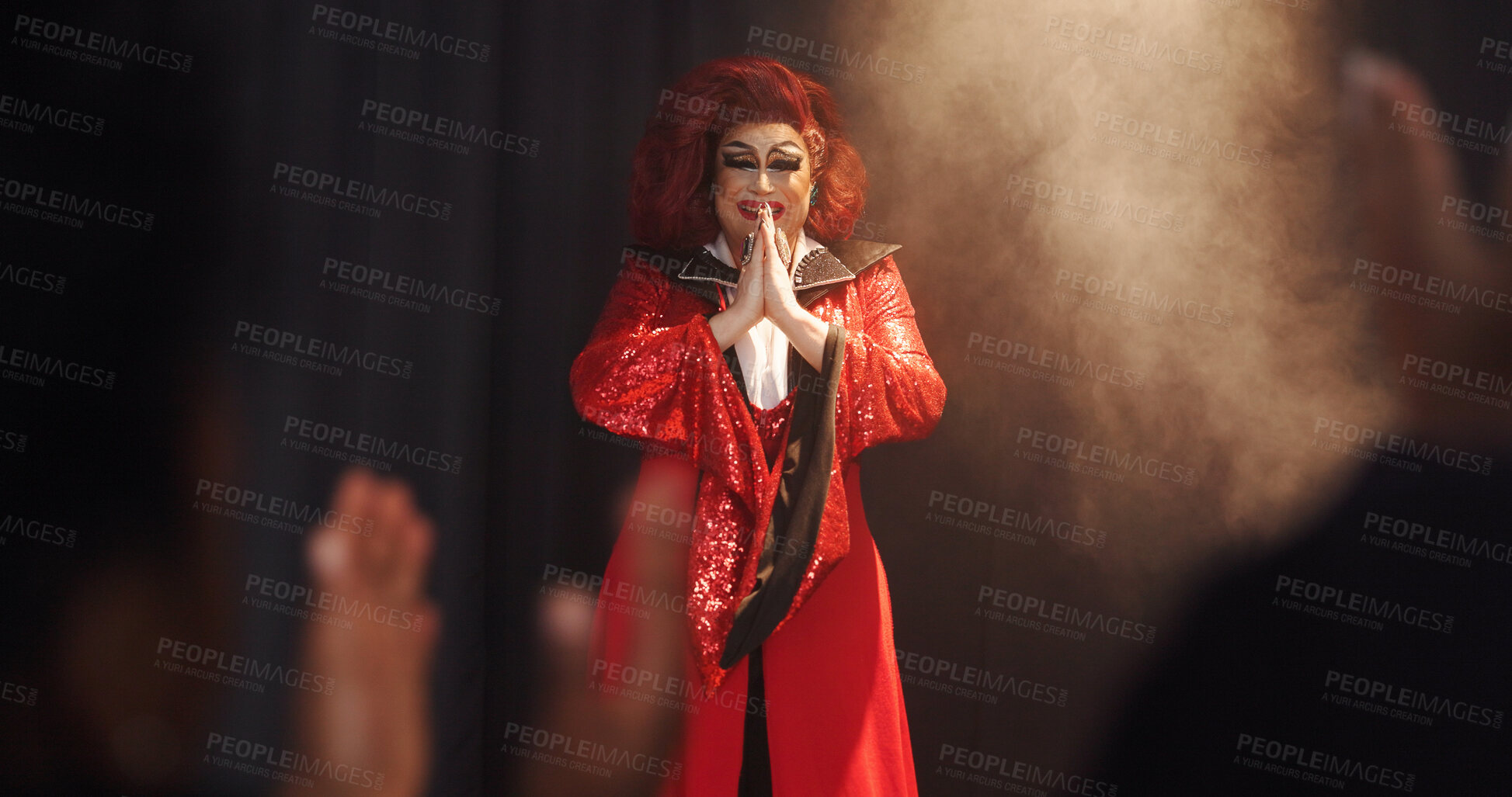 Buy stock photo Person, drag artist and smile with thanks, stage and excited with respect for crowd at cabaret show. Lgbt performer, musician or singer with gratitude, happy and pride with prayer hands for audience