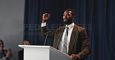 Buy stock photo Politics, speech or man at podium with fist raised, PR presentation and success in election. Press conference, dark or ambassador in auditorium with activism, address or crowd clap at seminar.