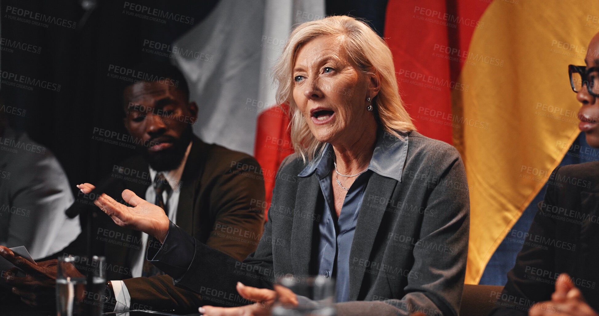 Buy stock photo Politics, group or woman with speech at press conference for media debrief, global summit or opinion. Government panel, forum and mature person with update on policy decision and diplomatic relations