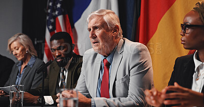 Buy stock photo Politics, group and man with speech at press conference for economic relations, delegation or feedback. Global forum, government panel and politician with discussion for policy decision or diplomacy