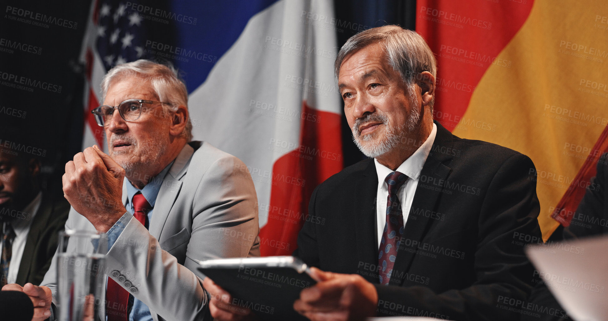 Buy stock photo Press conference, tablet and men with group for delegation, international government and panel. Summit, mature people and politician at speech event for diplomacy discussion, global forum or policy
