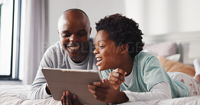 Buy stock photo Tablet, relax and dad with child on bed in home for watching movie, series or show together. Happy, bonding and African father with kid for streaming film on digital technology in bedroom at house.