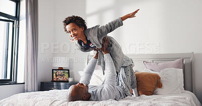 Buy stock photo Happy, child and father on bed for airplane game, support and relax for fun together in family home. Dad, boy and excited to fly for freedom, fantasy and balance to imagine play, trust or energy