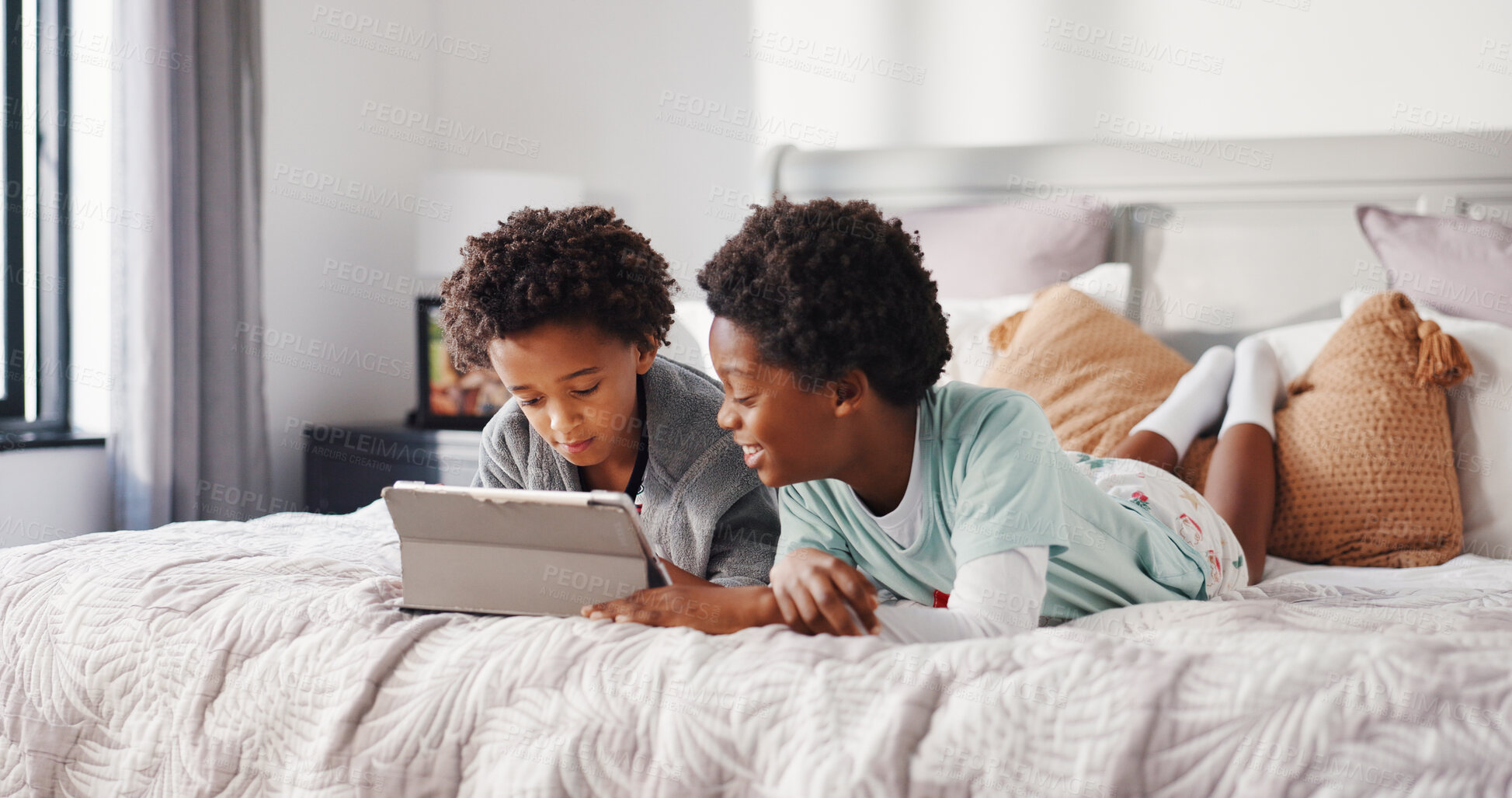 Buy stock photo Children, brothers and happy with tablet on bed for watching cartoon, playing games or bonding. Black family, kids or relax with digital app in home for streaming movie, subscription or weekend break