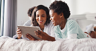 Buy stock photo Mother, child and happy with tablet on bed for watching cartoon, playing games and bonding. African family, people or relax with digital app in home for streaming movie, subscription or weekend break