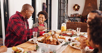 Buy stock photo Christmas, parents and kids with serving food in home for  festive feast, holiday celebration or eating. Lunch, african family and dining together at table for xmas tradition, brunch meal or bonding