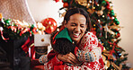 Happy mom, hug and child with love for christmas celebration, holiday or new year together in home. People, mother and kid with smile, embrace or care for festive weekend, family or bonding in house