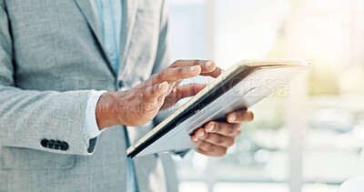 Buy stock photo Typing, hands and research with tablet in office, accountant and scroll for tax preparation or info. Browsing, online and person with technology for financial records, audit and filing returns on web