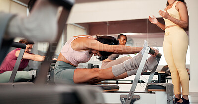 Buy stock photo Reformer, stretching and women in studio, instructor and fitness with pilates training. Healthy people, coach and group in wellness center, machine and exercise with challenge, endurance and balance