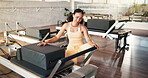 Reformer machine, fitness and woman in studio, setup and wellness with preparation. Equipment, person and instructor in health center, spring change and pilates training with safety check and core