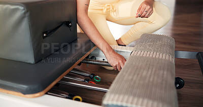 Buy stock photo Pilates, springs and woman with reformer machine, hands and fitness with workout equipment. Getting ready, wellness and alignment adjustment with person for mobility, class and prep with exercise