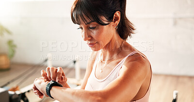 Buy stock photo Check, smart watch and woman in gym, fitness and tracking workout progress on website and heart rate. Health club, info and mature person with exercise goals, wellness and monitor pulse with tech