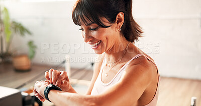 Buy stock photo Happy, woman and smart watch in gym, heart rate and tracking workout progress on website or fitness. Health club, online and mature person with exercise goals, wellness and tech with positive results
