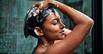 Shampoo, woman and washing hair in shower for dirt removal, haircare and scalp cleansing. Self care, water and person cleaning dandruff in home for repair treatment, grooming routine and cleanliness