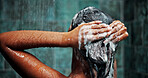 Shower, woman and shampoo for hair, cleaning or hygiene with morning routine in home. Soap, person or wash scalp with water, cosmetics or haircare treatment for beauty with foam in bathroom from back