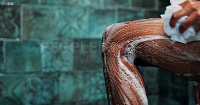 Buy stock photo Shower, washing leg and loofah with soap for hygiene, self care and grooming routine in bathroom. Cleaning body, bubble foam and person with sponge for morning skincare, space and wellness practice