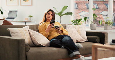 Buy stock photo Woman, phone and thinking with coffee on sofa, texting and web chat with online dating in home. Person, smartphone and decision with cup, drink and mobile app for social network on couch at house