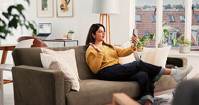 Buy stock photo Phone, video call and woman on sofa in apartment with communication, greeting and online conversation. Happy, waving and person with cellphone for virtual discussion with networking in living room.