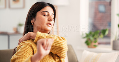 Buy stock photo Woman, discomfort and shoulder pain on sofa at house from inflammation, muscle stiffness and strain. Female person, backache and massage for pinched nerve, joint pressure and cramps from fibromyalgia