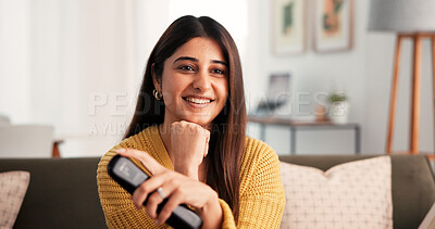 Buy stock photo Home, happy and woman with remote, watching tv and streaming movies with subscription in living room. Channel, change and Indian person with controller for entertainment, chill or comfortable on sofa