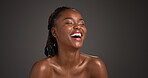 Beauty, skincare and woman with laughing in studio for natural glow, hydration and healthy skin. Mockup space, black girl and happy on gray background for body care, funny cosmetics joke and wellness