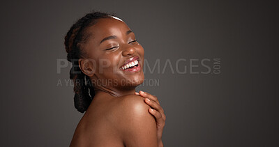 Buy stock photo Space, skincare and black woman in studio with laugh for cosmetics, self care and dermatology. Mockup, dark background and person with natural beauty, wellness and happy for glow, shine and health