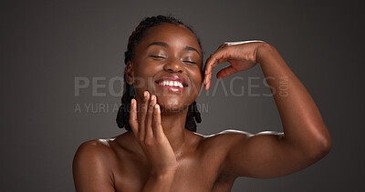 Buy stock photo Skincare, happy and black woman with hands in studio for hydration, wellness and natural beauty. Space, dermatology and person with touch, smile and aesthetic for healthy skin on dark background