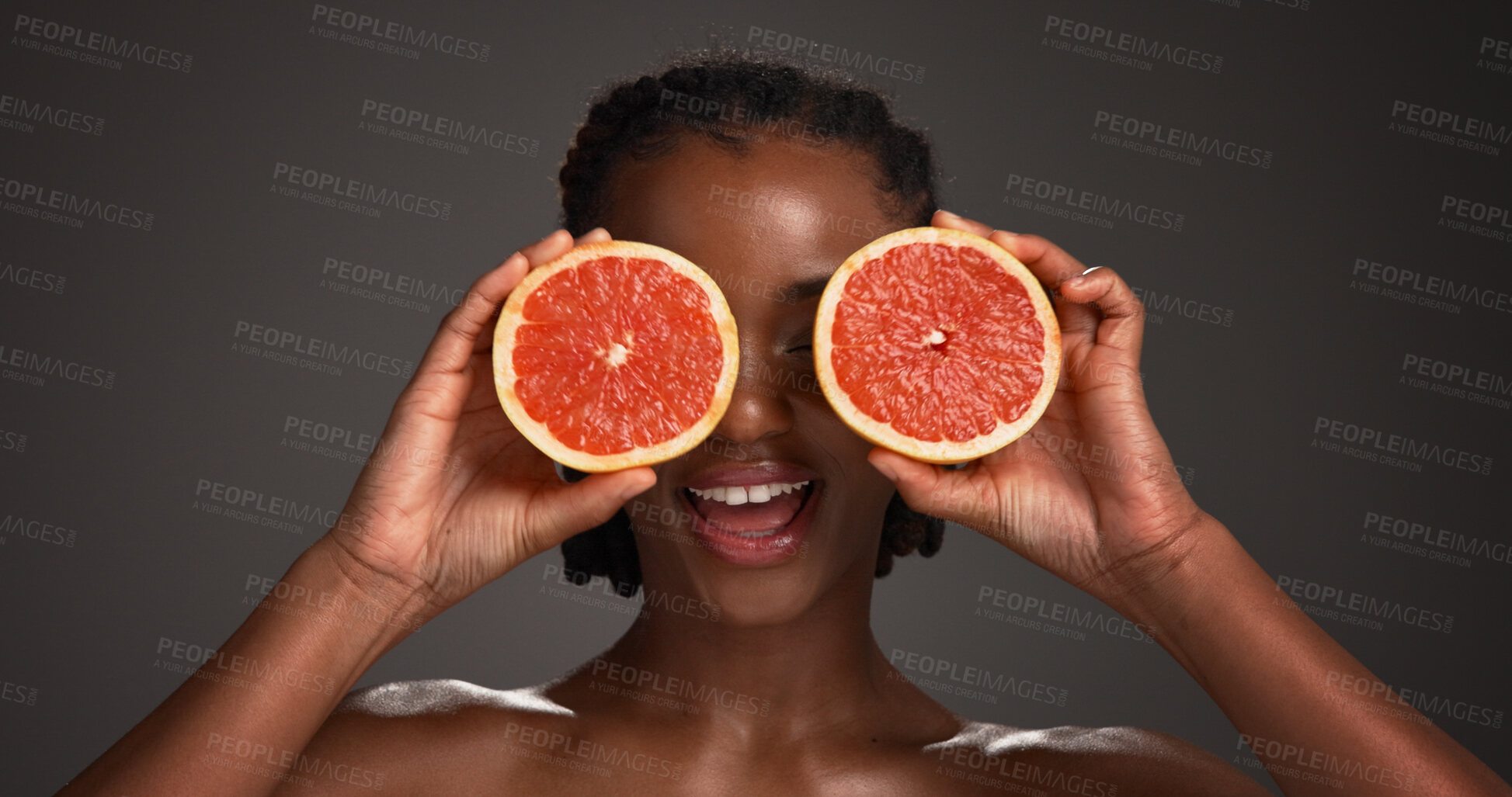 Buy stock photo Skincare, grapefruit and black woman in studio with wellness, health or organic facial glow. Vitamin c, beauty and African person with citrus fruit for dermatology hydration by gray background.