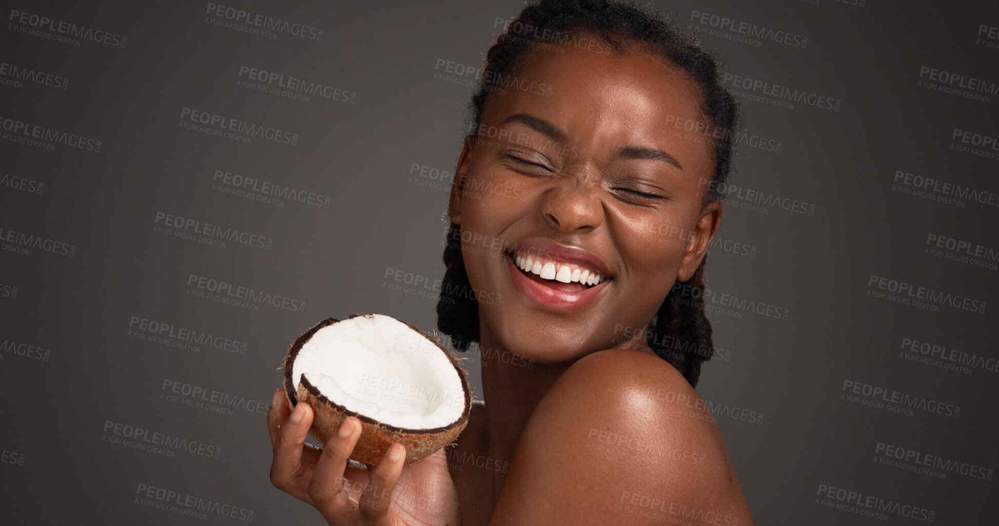 Buy stock photo Skincare, coconut and black woman in studio with natural, health and organic facial glow. Happy, space and African female person with fruit for face hydration with dermatology by gray background.